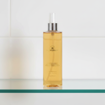 Mediterranean Vitalize Toned Lotion — prateleira de vidro com luz dourada